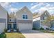 Two-story townhome with gray siding and a two-car garage at 14034 Clayborn St # 28, Midland, NC 28107