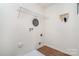 Laundry room with overhead shelving and white walls at 14034 Clayborn St # 28, Midland, NC 28107