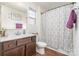 Clean bathroom with a shower/tub combo and patterned shower curtain at 14034 Clayborn St # 28, Midland, NC 28107