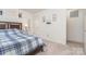 Well-lit bedroom with a double door closet and a blue and white comforter at 14034 Clayborn St # 28, Midland, NC 28107