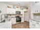 Modern kitchen with white cabinets, granite counters, and stainless steel appliances at 14034 Clayborn St # 28, Midland, NC 28107