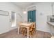 Charming dining area with white table and chairs by kitchen at 14034 Clayborn St # 28, Midland, NC 28107