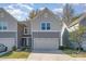 Two-story townhome with gray siding and a two car garage at 14034 Clayborn St # 28, Midland, NC 28107