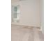 Simple bedroom with neutral decor and a window with patterned curtains at 14034 Clayborn St # 28, Midland, NC 28107
