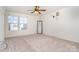 Bright bedroom with carpet flooring, neutral walls, and large windows at 14034 Clayborn St # 28, Midland, NC 28107