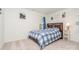 Cozy bedroom featuring a plaid comforter and built-in shelving at 14034 Clayborn St # 28, Midland, NC 28107