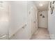 Upstairs hallway with two doors and neutral carpeting at 14034 Clayborn St # 28, Midland, NC 28107