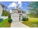 Two-story house with attached garage and front yard at 4127 Jacob Martin Dr, Charlotte, NC 28269