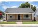 Newly renovated home with gray siding, wood porch, and manicured lawn at 201 Mccubbins St, Salisbury, NC 28144