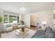 Spacious living room with a fireplace, large windows, and stylish furniture at 201 Mccubbins St, Salisbury, NC 28144