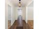 Light-filled hallway with dark wood floors and elegant chandelier at 201 Mccubbins St, Salisbury, NC 28144