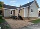 Rear view of house with steps and gravel landscaping at 201 Mccubbins St, Salisbury, NC 28144