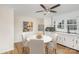 Eat-in kitchen with white cabinets, modern appliances, and round table at 201 Mccubbins St, Salisbury, NC 28144