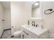 Clean bathroom with white vanity, toilet, and shower at 201 Mccubbins St, Salisbury, NC 28144