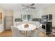 Eat-in kitchen with white cabinets and modern appliances at 201 Mccubbins St, Salisbury, NC 28144