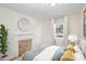 Bedroom with fireplace and large window at 201 Mccubbins St, Salisbury, NC 28144