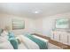 Bedroom with large bed, two windows, and built-in storage at 201 Mccubbins St, Salisbury, NC 28144