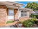 Brick front entrance with white door, shutters, and a small planter at 834 Brookwood Dr, Mooresville, NC 28115