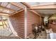 Long storage shed with various equipment and tools for outdoor maintenance at 834 Brookwood Dr, Mooresville, NC 28115