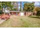 Large backyard with a shed, garden, and ample space for outdoor activities at 834 Brookwood Dr, Mooresville, NC 28115