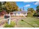 Brick ranch home with landscaped yard and brick walkway at 834 Brookwood Dr, Mooresville, NC 28115