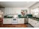 Kitchen features white cabinets, green countertops, and stainless steel dishwasher at 834 Brookwood Dr, Mooresville, NC 28115