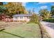 Brick ranch home with landscaped yard and brick walkway at 834 Brookwood Dr, Mooresville, NC 28115