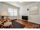 Simple bedroom with wood floors and window blinds at 834 Brookwood Dr, Mooresville, NC 28115