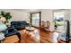 Living room with hardwood floors, leather couches, and a coffee table at 834 Brookwood Dr, Mooresville, NC 28115
