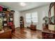 Spacious bedroom with hardwood floors, large window, and built-in shelving at 834 Brookwood Dr, Mooresville, NC 28115