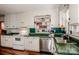 Kitchen boasts white cabinets, green countertops, and a built-in oven at 834 Brookwood Dr, Mooresville, NC 28115