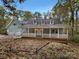 Charming two-story home with a large deck and attached garage at 1259 Blacksnake Rd, Stanley, NC 28164
