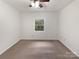 Spacious bedroom with neutral carpet and large window at 1259 Blacksnake Rd, Stanley, NC 28164
