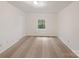 Bright bedroom with neutral carpet, window and closet at 1259 Blacksnake Rd, Stanley, NC 28164