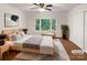 Main bedroom with wood flooring, large window, and ample closet space at 1259 Blacksnake Rd, Stanley, NC 28164