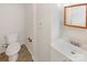 Clean bathroom with white vanity, toilet and tile flooring at 1259 Blacksnake Rd, Stanley, NC 28164