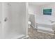 Updated bathroom with shower and a jetted bathtub at 1259 Blacksnake Rd, Stanley, NC 28164