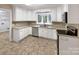 Modern kitchen with white cabinets and stainless steel appliances at 1259 Blacksnake Rd, Stanley, NC 28164