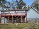 House exterior with large deck and fenced backyard at 1259 Blacksnake Rd, Stanley, NC 28164