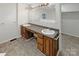 Bathroom with double vanity and updated fixtures at 1259 Blacksnake Rd, Stanley, NC 28164