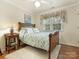 Cozy bedroom with hardwood floors and antique bed at 112 N Sardis View Ln, Charlotte, NC 28270