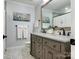 Updated bathroom with double vanity, gray cabinets, and marble flooring at 112 N Sardis View Ln, Charlotte, NC 28270