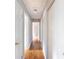 Clean hallway with hardwood floors and access to multiple rooms at 503 Cherry St, Belmont, NC 28012