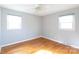 Bright bedroom with hardwood floors and neutral walls at 503 Cherry St, Belmont, NC 28012