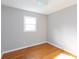 Simple bedroom with hardwood floors and a window providing natural light at 503 Cherry St, Belmont, NC 28012