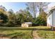 Small shed in the backyard with a pathway at 503 Cherry St, Belmont, NC 28012