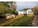 Side of the house with a small shed in the yard at 503 Cherry St, Belmont, NC 28012