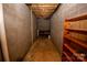 Unfinished basement area with brick walls and shelving at 539 Bethlehem Rd, Statesville, NC 28677