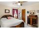 Bedroom with ceiling fan, double bed, and vintage dresser at 2916 Lake Dr, Shelby, NC 28152