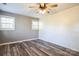 Bedroom with gray walls, wood-look floors, and white shiplap feature wall at 3819 Centergrove Rd, Concord, NC 28025